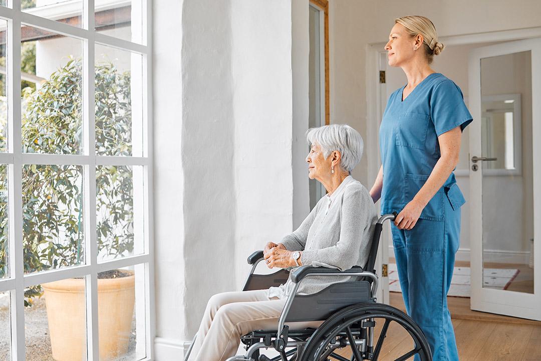 Elderly with healthcare professional An elderly being assisted by a healthcare professional